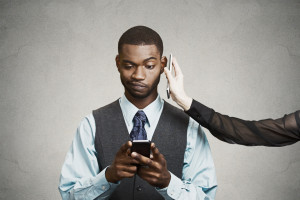 Headshot confused businessman reading bad news on smart phone
